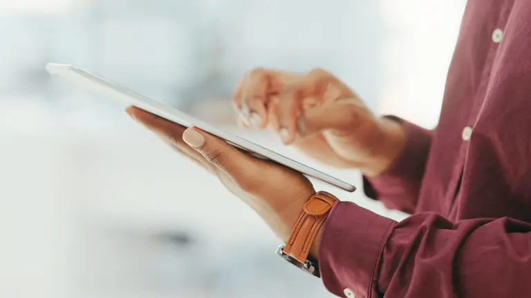 A person looking at the tablet.